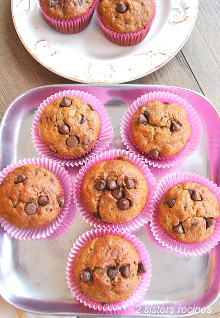 Paleo Banana Chocolate Chip Muffins placed on a silver serving tray. 
