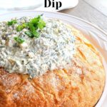 Easy Knorr Spinach Dip served inside a round loaf of bread.
