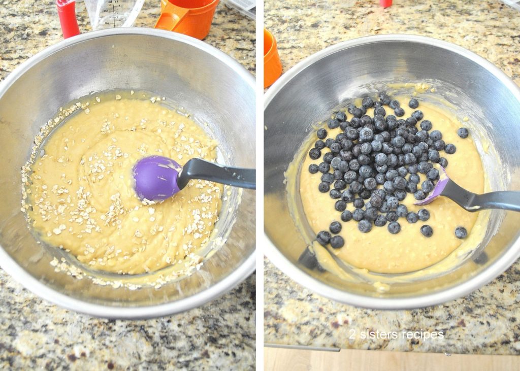 Mixing blueberries into the batter in a mixing bowl. by 2sistersrecipes.com 