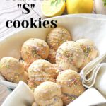 A basket filled with letter S cookies.