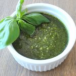 A white ramekin filled with spinach pesto sauce
