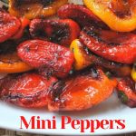 Charred mini peppers served in a white platter,