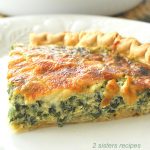 A slice of a quiche filled with green vegetables