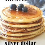 Lemon Ricotta Silver Dollar Pancakes served on the white and blue plate.