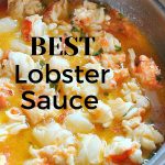 Best Lobster Sauce is typed over the skillet filled with cooked lobster in butter sauce.