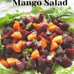 Beets and Mango Salad served on a bed of lettuce.