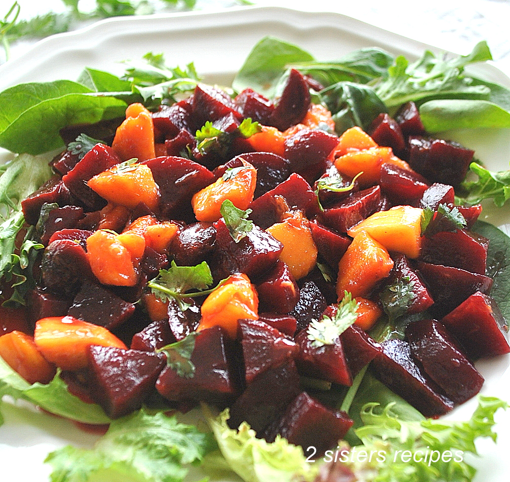 Beets and Mango Salad set on a bed of lettuce.