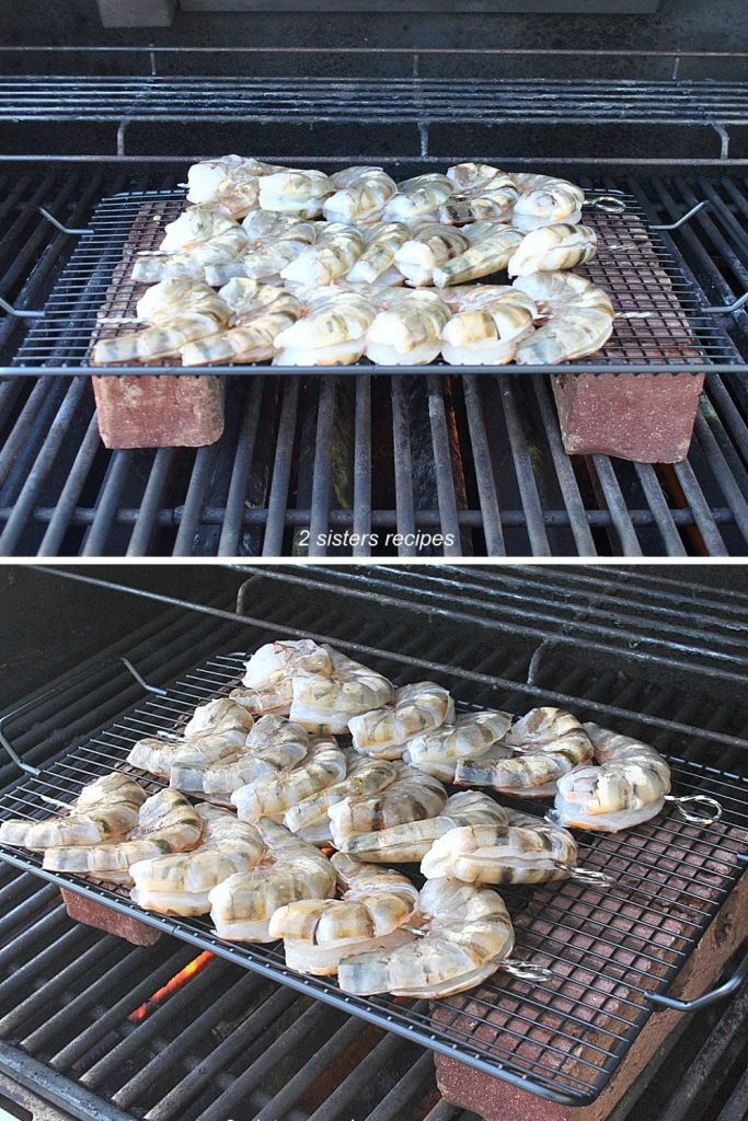 A photo of shrimp kabobs placed onto a grill set over two bricks. by 2sistersrecipes.com