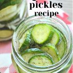 An open mason jar filled with sliced pickles with its marinade.