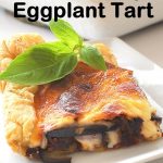 A square piece of Italian Savory Eggplant Tart is served on a white plate.