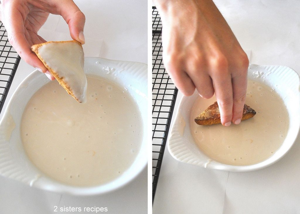 Dipping the scones into the glaze. by 2sistersrecipes.com