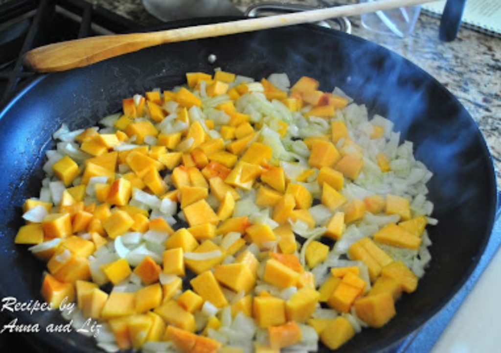 In a large skillet, butternut squash is simmering on stovetop. by 2sistersrecipes.com