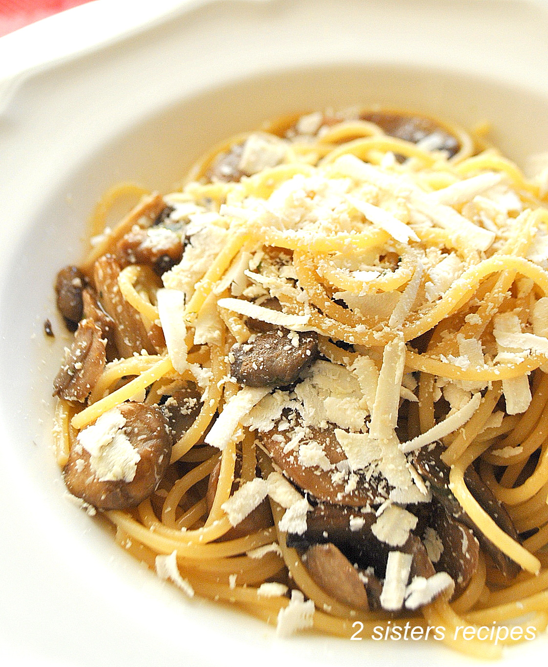 A plate of spaghetti topped with Wild Mushrooms with Cognac and Truffle Oil. 