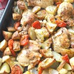 Full baking pan with chicken thighs and veggies. by 2sistersrecipes.com