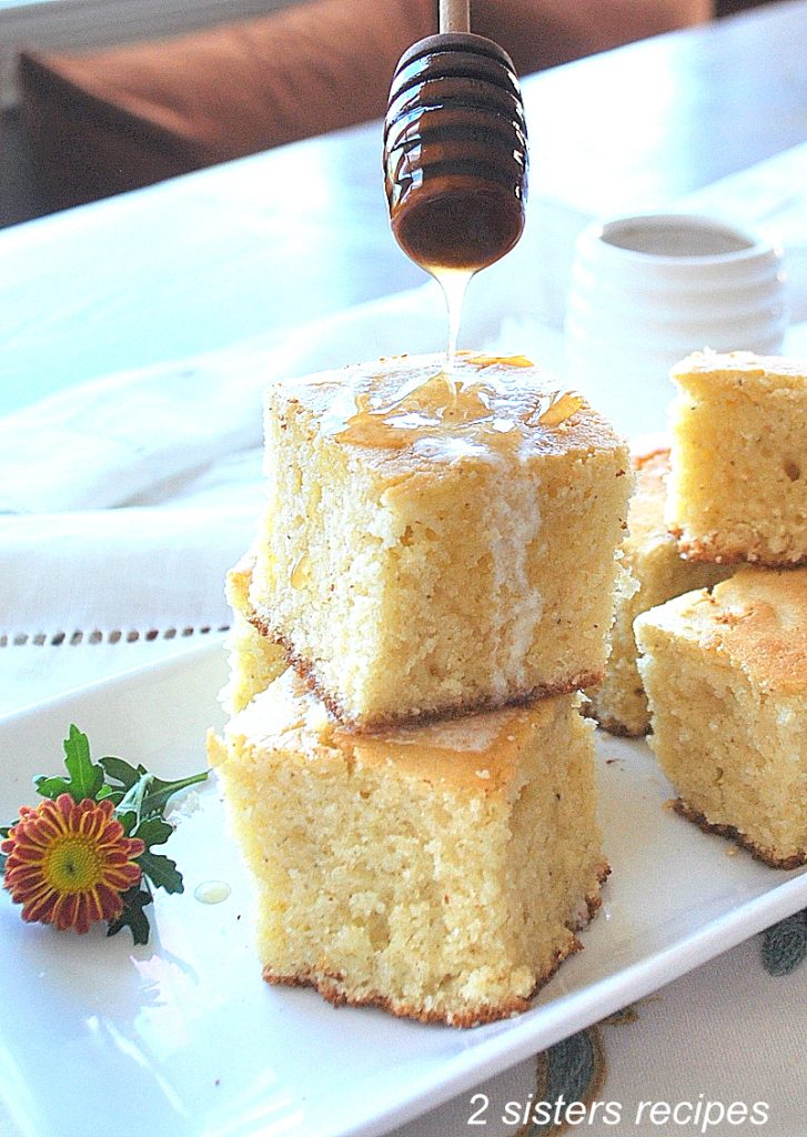 honey drizzled over our most popular corn bread  by 2sistersrecipes.com