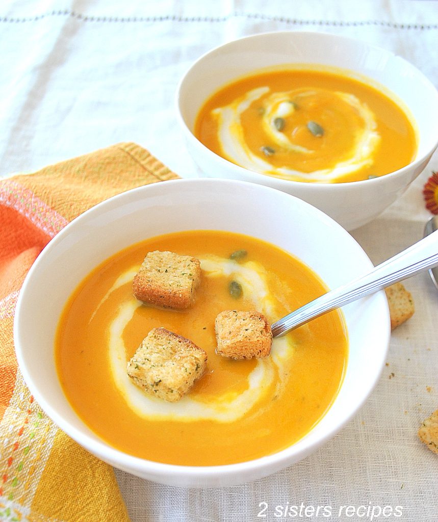 A bowl of soup with some croutons on top. by 2sistersrecipes.com