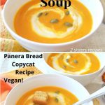 Two white bowls of creamy squash soup, with a swirl of cream and pumpkin seeds, and croutons on top.