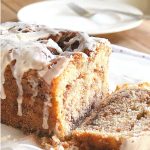 A slice of Cinnamon Swirl Quick Bread served on a white plate.