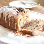 A slice of Cinnamon Swirl Quick Bread on a white plate.