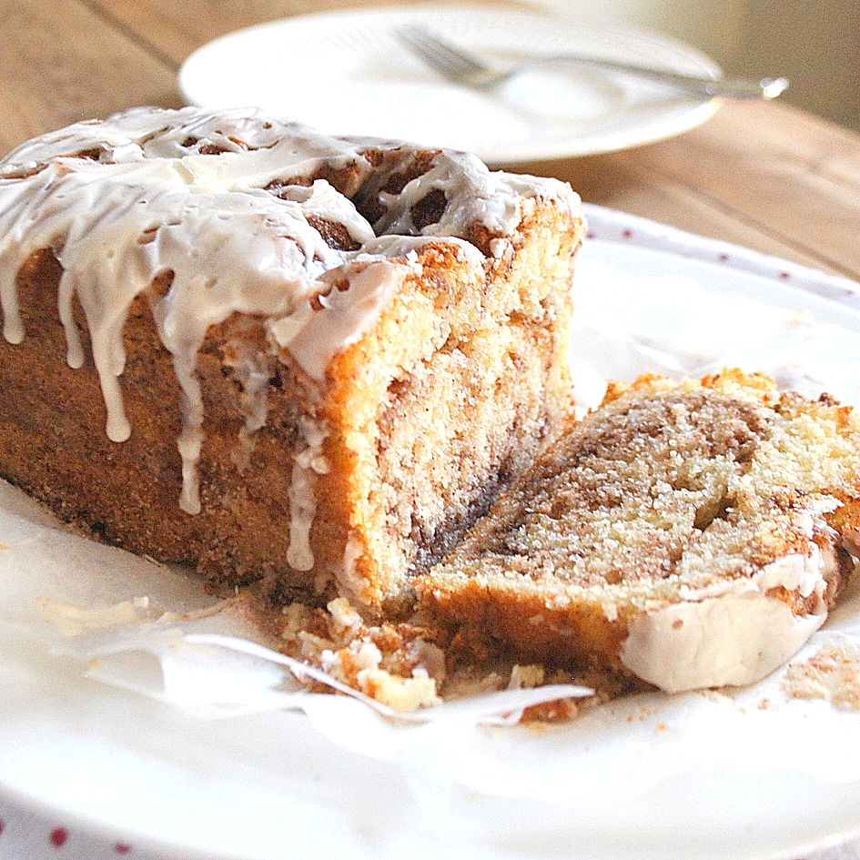 Cinnamon swirl bread is sliced on a white plate.