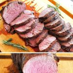A wood cutting board with a tenderloin sliced.