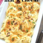 A white casserole dish filled with tortellini mac and cheese.