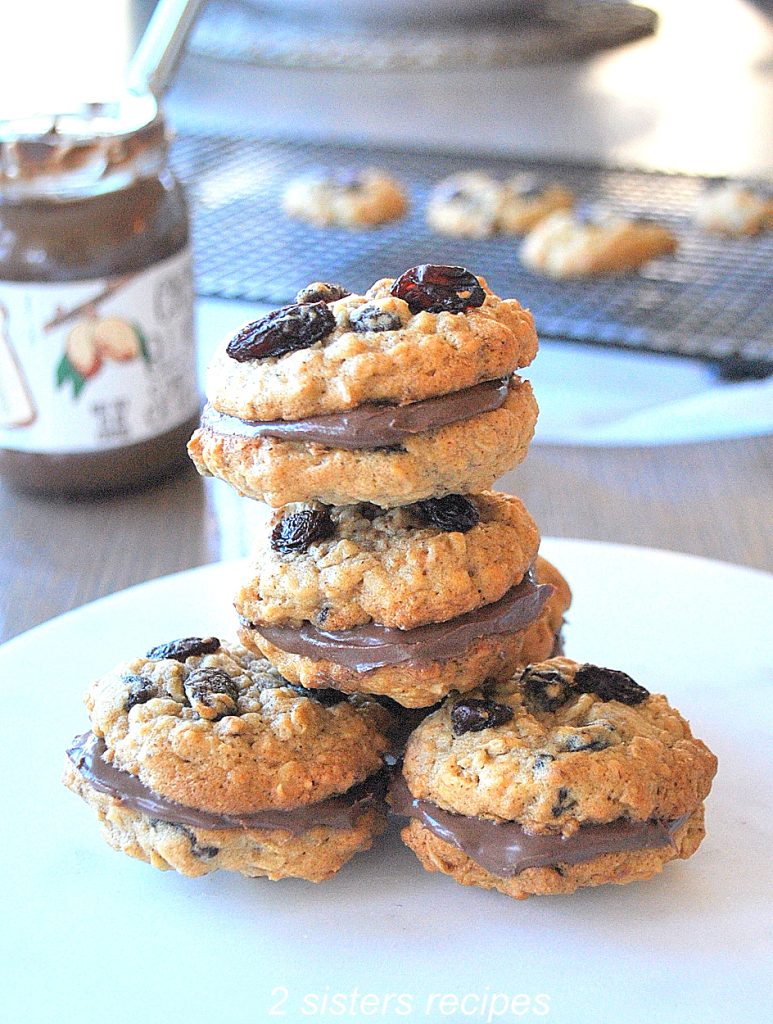 Four cookies on top of one another. by 2sistersrecipes.com
