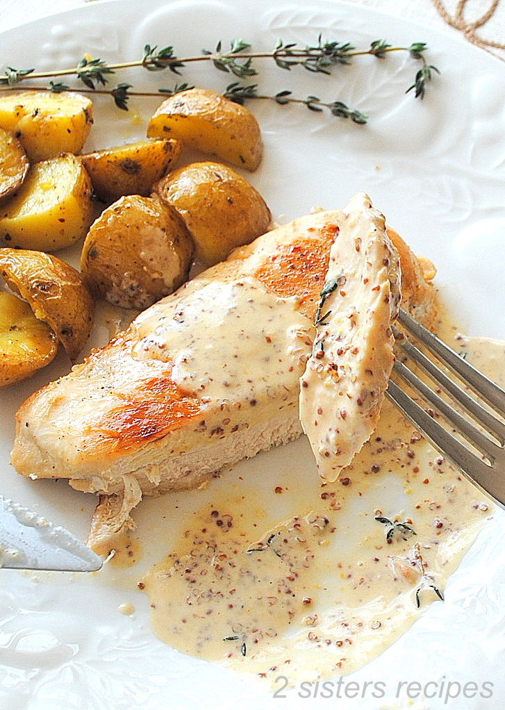 A piece of chicken breast on a fork. by 2sistersrecipes.com