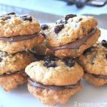 a plate filled with oatmeal raisin cookies. by 2sistersrecipes.com