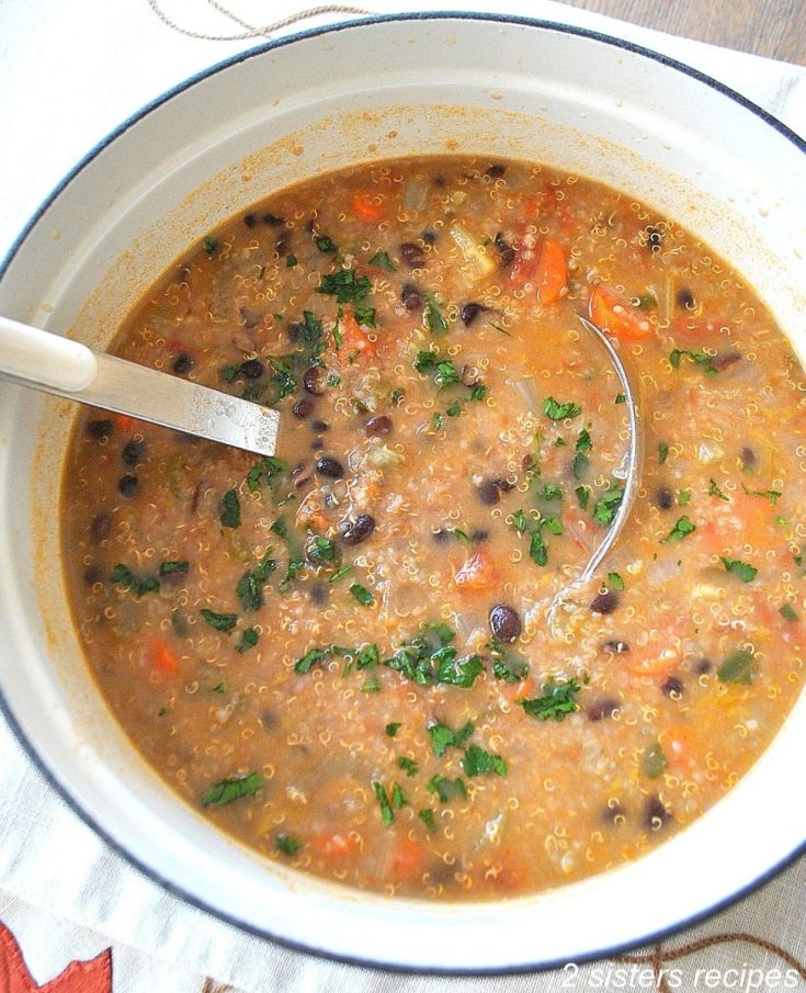 A large pot filled with black bean soup. by 2sistersrecipes.com