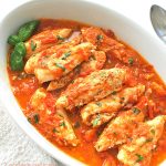 Chicken Tenders simmered in a tomato sauce.
