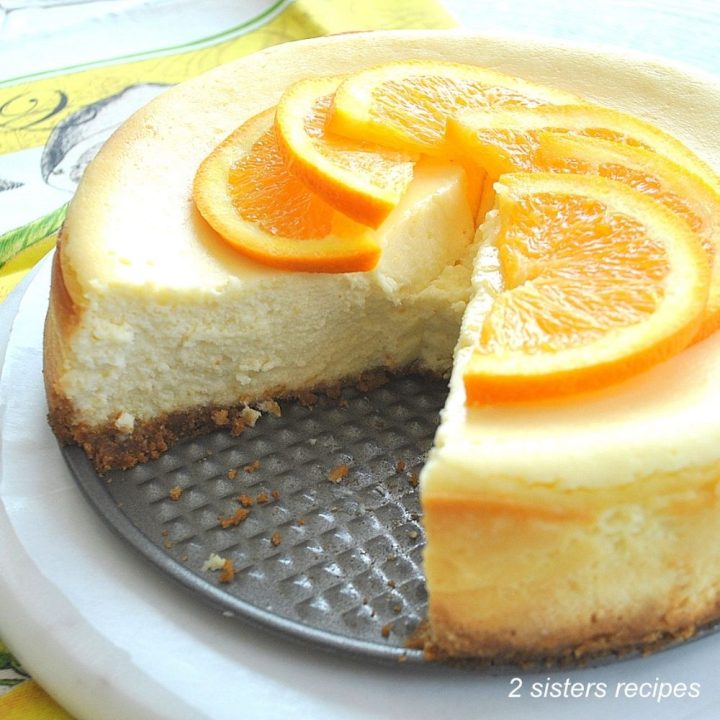 Creamy Italian Cheesecake with sliced oranges on top. for fat Tuesday or any holiday.