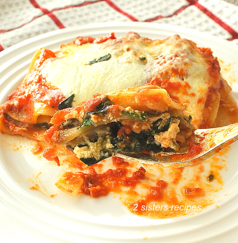a forkful of our roasted eggplant spinach lasagna. by 2sistersrecipes.com