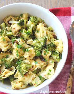 Tortellini and Broccoli Salad served in a white bowl.