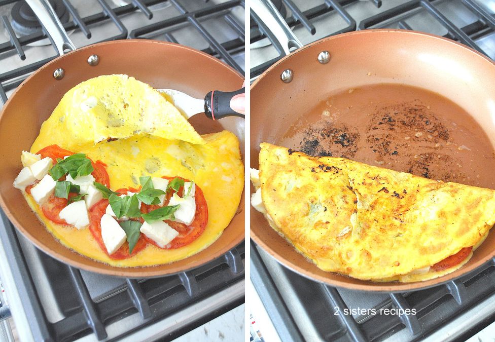 Using a small spatula to flip one side of omelet over to the other side. by 2sistersrecipes.com