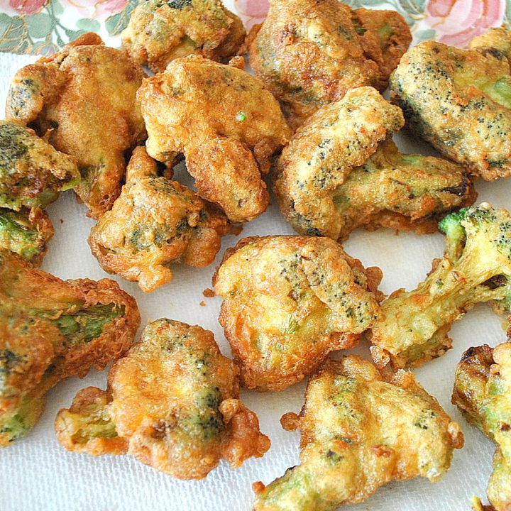 On a paper towel, filled with broccoli fritters.