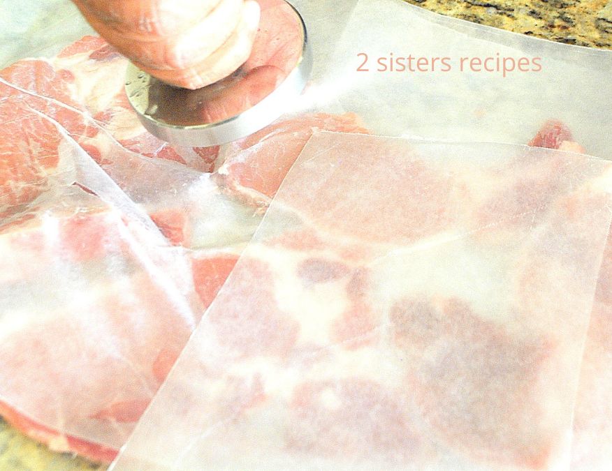 Pounding pork cutlets with a mallet. by 2sistersrecipes.com