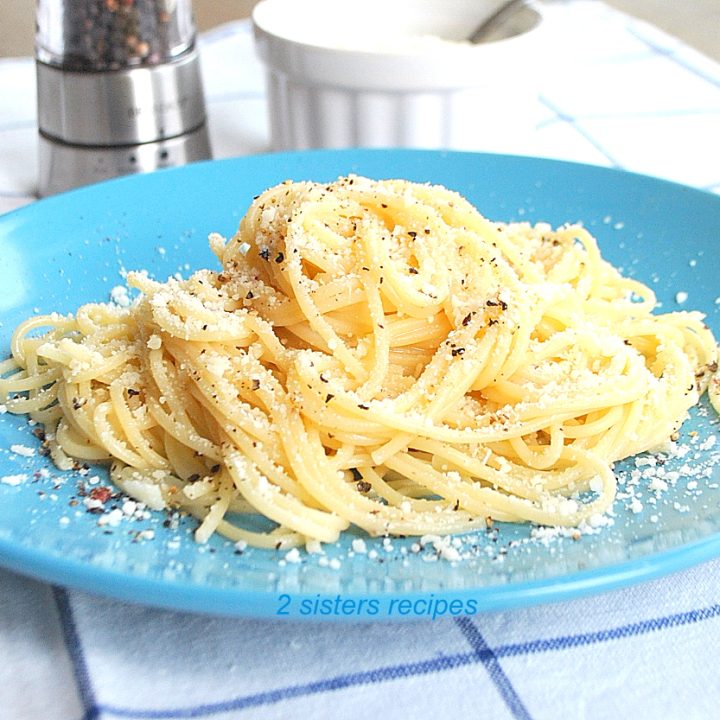 Spaghetti on a blue plate. by 2sistersrecipes.com