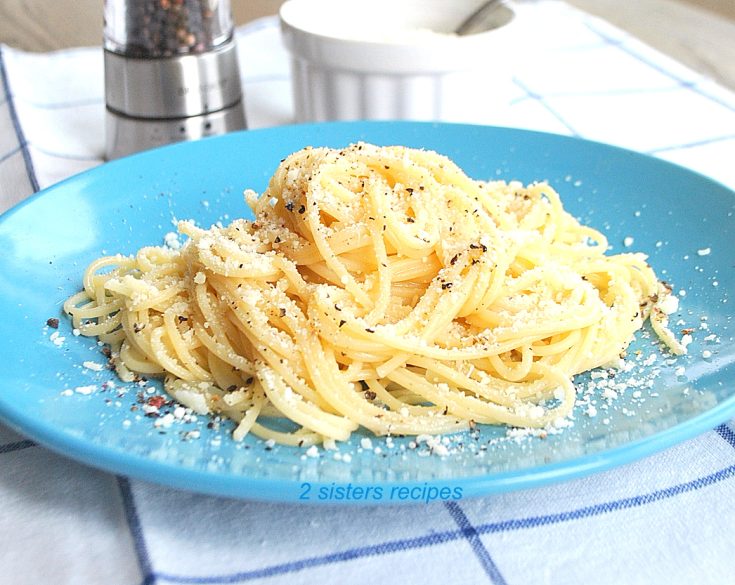 Spaghetti on a blue plate. by 2sistersrecipes.com