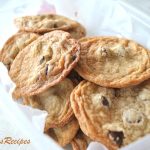 thin cookies in a plastic clear container.
