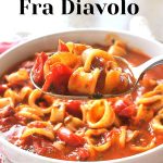 A spoonful of calamari rings smothered in a spicy tomato broth.