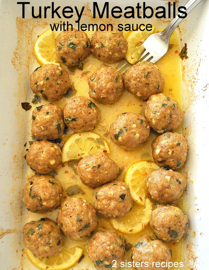 A white baking dish filled with Turkey Meatballs with Lemon Sauce. 