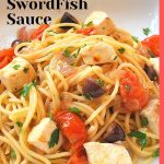 Spaghetti tossed with cubes of swordfish and fresh cherry tomatoes and herbs.