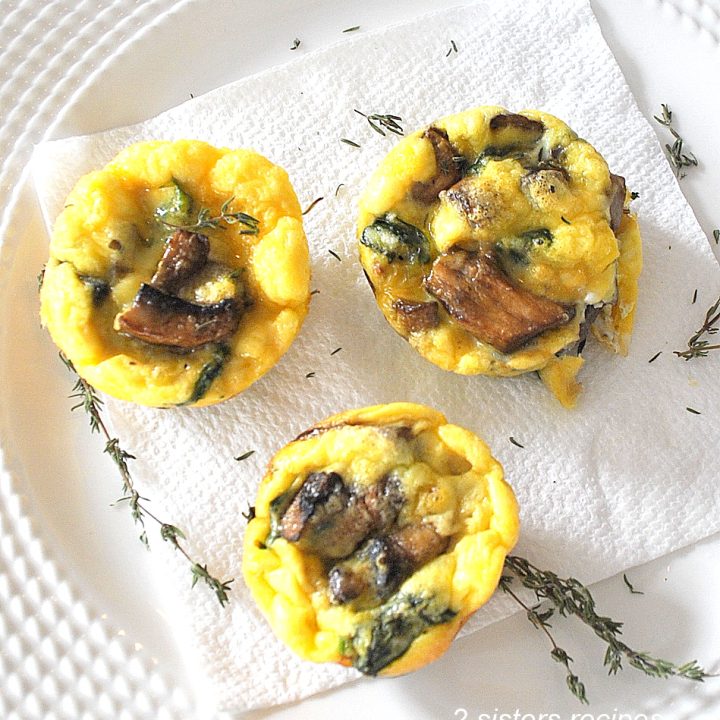 2 mini mushroom frittatas on a white napkin.