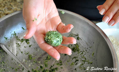 A ball of spinach in the palm of a hand. by 2sistersrecipes.com