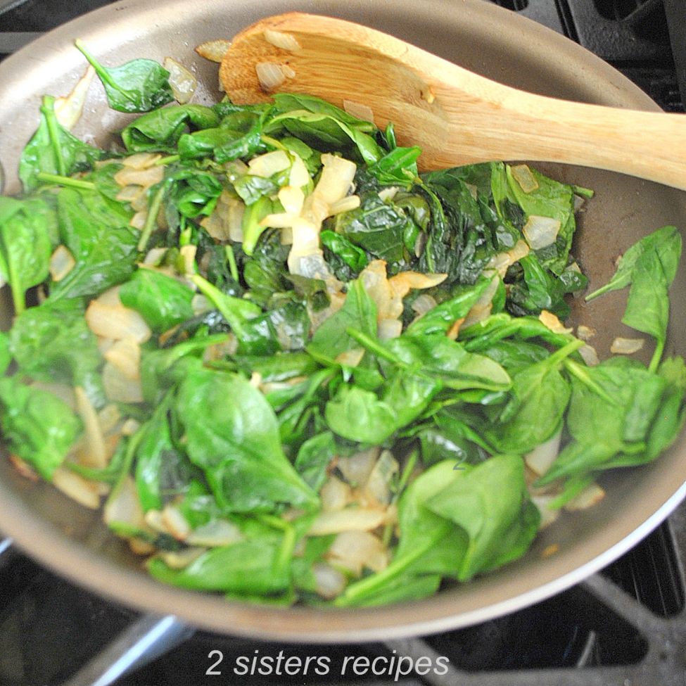 A skillet sauteing the vegetables. by 2sistersrecipes.com