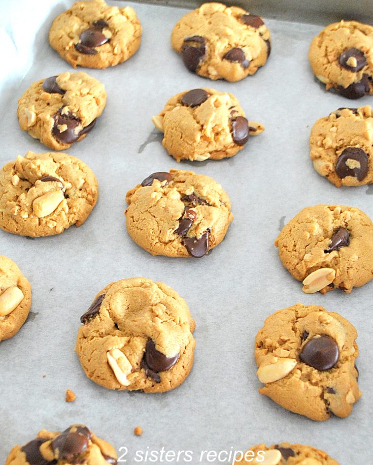 A cookie sheet with baked cookies on it. by 2sistersrecipes.com