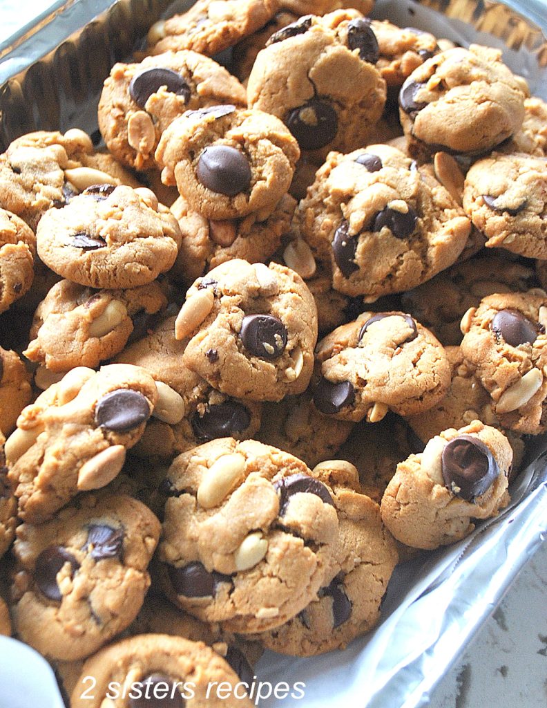 A silver tray filled with Peanut butter cookies. by 2sistersrecipes.com