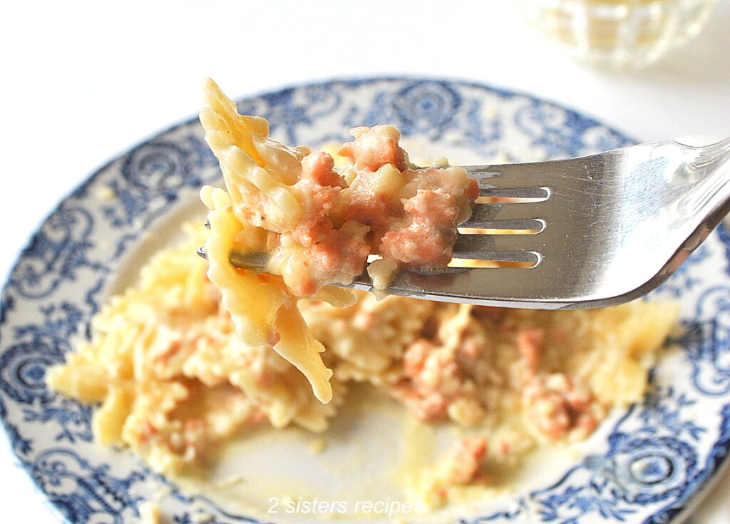 A forkful of pasta with a smoked salmon sauce.