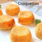 Mashed Potato Cakes ( croquettes) served on a white platter.